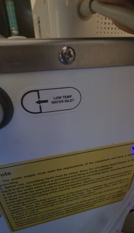Chiller port label reading LOW TEMP WATER INLET